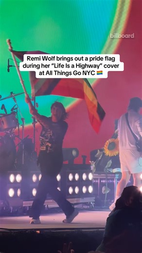 Remi Wolf brings a progress pride flag onstage while covering “Life is a Highway” at All Things Go NYC | Billboard