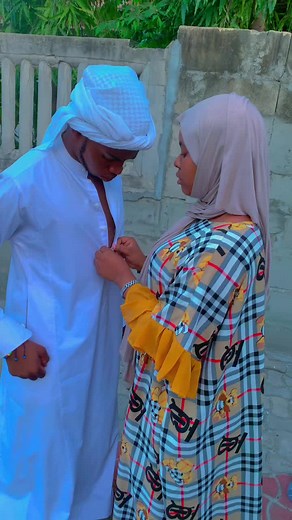 Cultural Fashion: Traditional Thobe and Colorful Dress