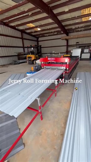 Metal roofing panel roll former with automatic hydraulic decoiler working in client workshop