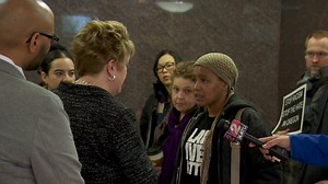 Civil rights activists confront state education leaders during anti-racism protest