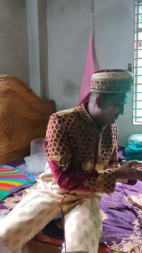 Cultural Attire and Modern Interaction in a Rustic Room