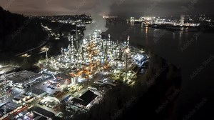 Oil refinery aerial view at night, hyper lapse, distillation tower, gas production, smoke stack, near Vancouver, Canada. 4K 24FPS