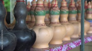 Handmade traditional craft known as 'labu sayong' normally used as gift or souvenir found in Perak,Malaysia. Clay pottery arts. Artistic clay container carving. UNGRADED.Panning Shot