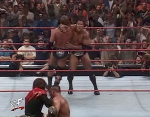 On September 26, 1999 the WWF’s second annual Unforgiven pay-per-view took place in front of 15,779 fans at the Charlotte Coliseum in Charlotte, North Carolina. The main event was a Six-Pack Challenge–a non-elimination match consisting of six wrestlers for the vacant WWF World Heavyweight Championship. Stone Cold Steve Austin served as the special outside enforcer for the match (which he spent most of his time on commentary with Jim Ross and Jerry “The King” Lawler). The match included Triple H,