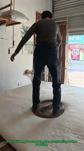 Cotton Wadding Compaction: Man Uses Traditional Technique to Press Cotton Evenly