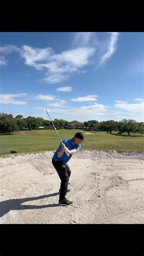Unc demonstrates how to get out of a sand trap while golfing