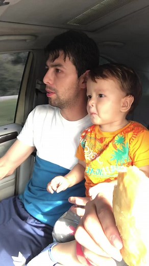 Car Snack Time: Adult and Child Enjoy Pastry Together