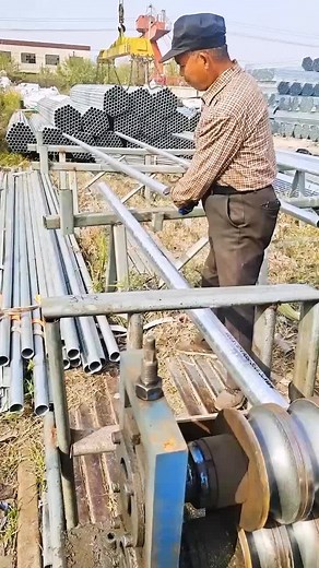 Industrial Pipe Processing: Worker Machine Operation