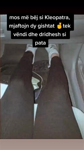 Close-Up View of Feet and Legs in Car Interior