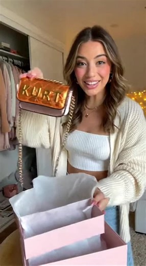 My new favorite tiny bag! 🧡 This metallic orange and pink crossbody is so on-trend for 2026. The “KURT” logo adds a fun, edgy touch, and the chain strap is adjustable for hands-free wear. I use it for nights out—fits my phone, lip gloss, and keys perfectly. Great for anyone who wants a statement piece that’s both cute and functional.#MiniCrossbody #MetallicBag#Y2KStyle #NightOutEssentials #FashionTrend2026