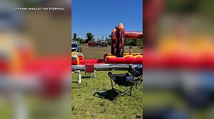 Florida firefighters hose down bouncy slide