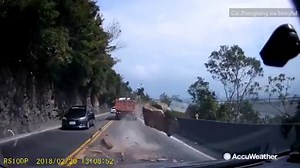 WOW! Dashcam footage of a huge boulder narrowly missing several cars and trucks on a highway! | AccuWeather