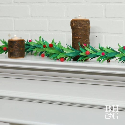 Would you ever guess this adorable holly garland is made of recycled egg cartons? It's super cute, and good for the environment, too! Get the how-to: https://bit.ly/3fDj2sF | Better Homes & Gardens