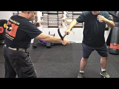 Cane Self Defense with using the shadow hawk against a bladed weapon and other techniques.