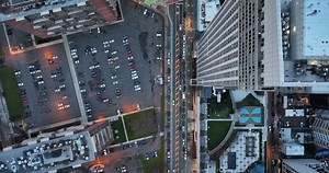 Jersey City, NJ USA May 5 2024 Large Skyscraper with nyc in background. Evening Sunset shots. Hudson river and East river combined. Drone shots of Jersey city