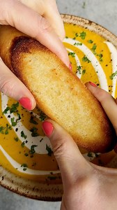 CREAMY CURRIED BUTTERNUT SQUASH SOUP! This is one of my oldest soup recipes—can be made with sweet potato as well. SO FREAKING DELICIOUS 🤤 • 2 tbsp olive oil 1 onion, halved 1 stalks celery 1 head garlic, top cut off 1 15-oz can whole fat coconut milk 1 cup broth 1 butternut squash, halved lengthwise wyth seeds removed 2 tsp paprika 1 ½ tsp curry powder * 1 tsp salt 1-2 tbsp butter, optional • Optional toppings: Fresh cilantro Extra coconut milk • 1️⃣Preheat the oven to 425. Line a sheet pan wi