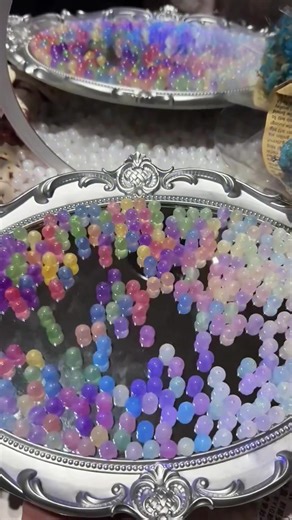 Who can resist a tray full of rainbow color-changing beads?🌈✨ It's like someone crushed the galaxy and sprinkled it right here😍🌸 Perfect for your next DIY project - magical, shimmery, and totally unique!✌🏻#diyjewelry #colorchangingbeads #beadedbracelets #diy