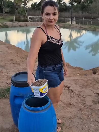 Beautiful Woman Feeding Fish in Pond | Fish Farming Village Life | Fish Feeding at Farm #villagelife #girl #milk #shorts #2026