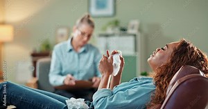 Therapy, crying and woman on sofa with tissue for anxiety, trauma or stress in ptsd treatment. Mental health, medical advice and girl with therapist, consultation or alternative medicine counseling