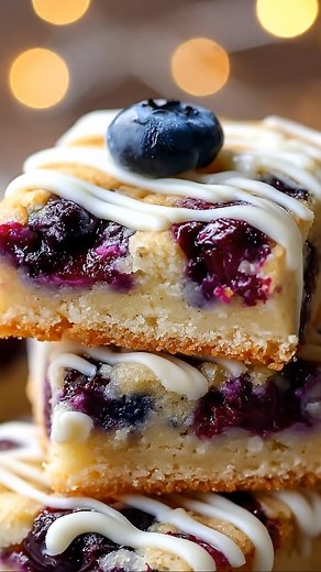5.5K views · 136 reactions | Luscious Blueberry Lemon Cookie Bars with White Chocolate Drizzle Ingredients: ½ cup (about 115 g) unsalted butter, softened ¾ cup (about 150 g) granulated sugar 1 large egg ...... Full Recipe in Coʍmеոτ  | Recipes By Legend | Facebook