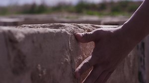 Hand touch stone wall. Hand mans touches the stone wall. Man longing for the native land and places, the concept of the Motherland