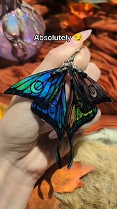 26K views · 2.2K reactions | ✨Gothic fairies, are you out there??✨ Lots of people say they want these earrings without the rainbow, but I love that pop of color in direct light. They really are just black in the shade and at night! And it wouldn't be my art without some sparkle  #fairy #fairywings #fairycore #cottagecore #alternativefashion #lunamoth #holographic #rainbow #suncatcher #wedding #fantasy #fashion | Maythriel | Facebook