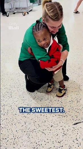Little boy spreads joy by giving hugs