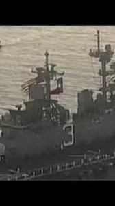 Crew members line up on USS Kearsarge as it sails to Houston for Fleet Week