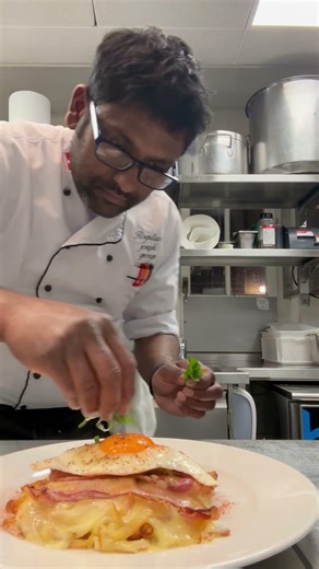 Homemade Bernese rösti with cheese, bacon and onion fried egg best in Swiss food