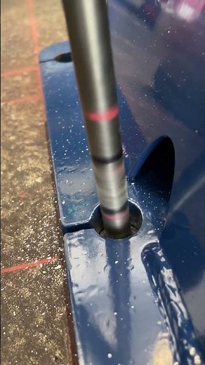 Drilling concrete holes for a car lifts anchors with a Bosch drill hammer