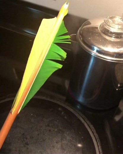 Archery, How to fix damaged fletchings. Adding steam to the feathers rejuvenate your fletchings.