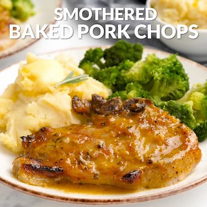 Juicy and tender, sweet and savory, these Smothered Baked Pork Chops are roasted to perfection in just 30 minutes! Pork chops are smothered in a homemade butter-rosemary-honey-mustard sauce and baked to juicy perfection! --> https://laurenslatest.com/smothered-baked-pork-chops/ | Lauren's Latest