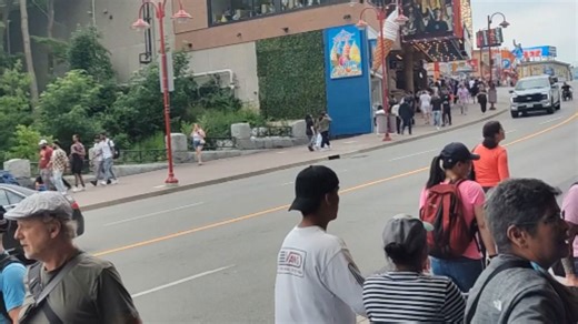 Guy lives his best life by riding down Clifton Hill in his wheelchair