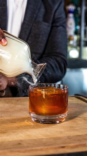 A cocktail that is as captivating as it is luxurious. ⁠ ⁠ Smoked Old Fashioned: Angels Envy Rye Whiskey, house demerara syrup, angostura & orange bitters, and charred cherry wood smoke. ⁠ ⁠ Video: @oceanprime_kansascity | Ocean Prime