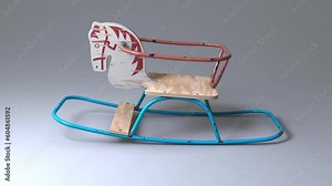 An empty vintage retro rocking horse seating toy made of iron bars and wood rocking back and forth on an isolated dark studio background