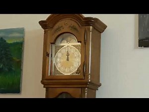 Four antique clocks (combined ages approximately 400 years old) ringing midnight.