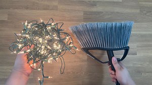 Wrap string lights around a broom for this amazing idea! | Hometalk