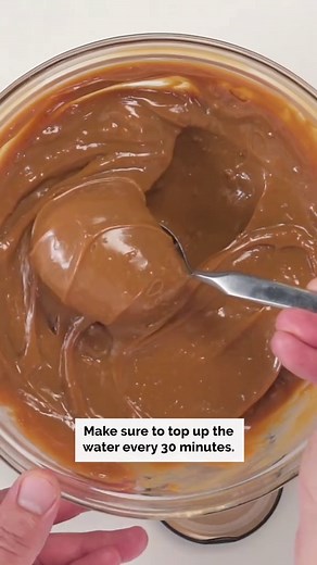 1-ingredient condensed milk caramel: the sweetest trick in the world! Recipe ⬇️ 2 x 397g cans sweetened condensed milk Preheat oven to 220°C/200°C fan forced. Place a 2.5L (10-cup) baking dish inside a large roasting pan. Pour the cans of sweetened condensed milk into the baking dish. Pour water into the roasting pan until it comes halfway up the side of the baking dish. Cover the baking dish tightly with foil. Place the roasting pan in the oven and cook for 1 hour and 45 minutes or until the co