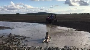 Looks like fun 😃🏄‍♂️ Henry and Albie Crocker got a chance to enjoy the mud and water after a nice 88 mm downpour at Crochdantigh, west of Roma. How have you been celebrating the rain? | ABC Brisbane