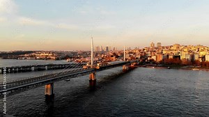 Drone shot of the Golden Horn Bridge in Istanbul. Cable-stayed bridge in Istanbul. A narrow curved bay that flows into the Bosphorus at its junction with the Sea of ​​Marmara. Metro line in Istanbul.