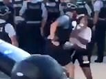 Video: Protester gets her teeth knocked out by Chicago police officer | Daily Mail Online