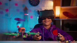 clip-1098709669-intelligent-kid-controlling-drone-by-wearing-vr