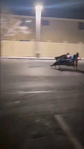 Couchsurfing being pulled by a car with a string on the couch crazy