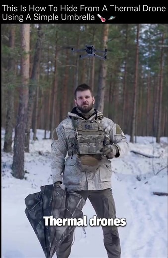 A $20 umbrella just confused a military-grade infrared sensor. 🌡️🛸 Thermal drones don't care about camouflage patterns, snow suits, or colors. They detect infrared radiation, which means they're looking for temperature differences. In cold environments, the human body at roughly 33°C stands out dramatically against snow that can sit near 0°C or lower. That contrast is what makes a person glow white-hot in IR. In this test, the drone switches to thermal mode and instantly identifies a standing 