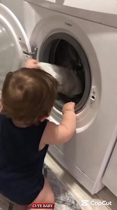 Busy washing clothes in the washing machine #cutebaby #cute | Cute Baby