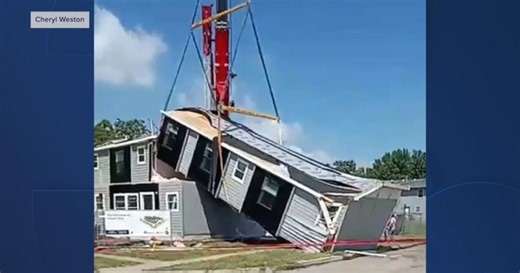 Modular home snaps while being dropped by crane