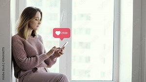 Woman blogger browsing phone sitting on window, infographic sign with numbers and growing likes counter over smartphone. Concept of modern work and popularity in social media.