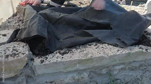 A man makes an Alpine rock garden. Step-by-step instructions.