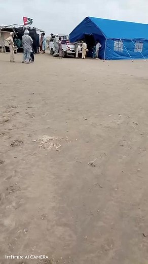 Traditional Outdoor Gathering in Sandy Camp Setting