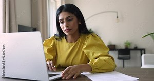 Woman working online on laptop feels troubled with sudden computer failure, having problems with laptop. System error, data loss, battery issues, unsaved information, need repair due to hanging device